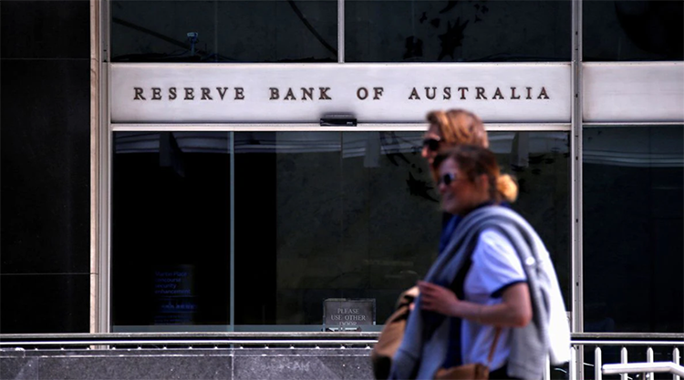 The Australian central bank raises interest rates, warning that more are on the way