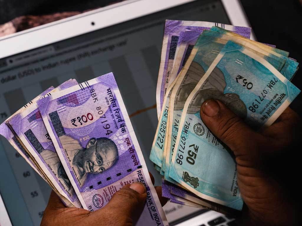 Indian rupee climbs to six-month high, leading Asian currency rally