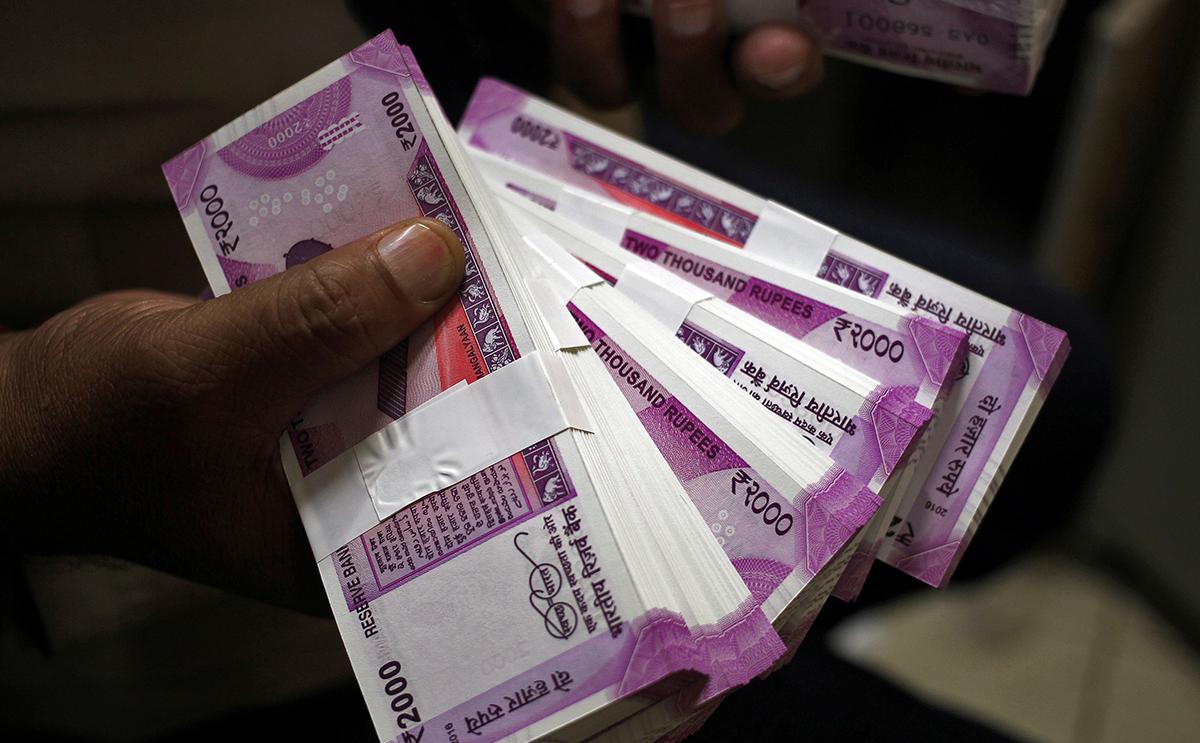 Rupee surges on suspected RBI intervention, biggest gain in two years